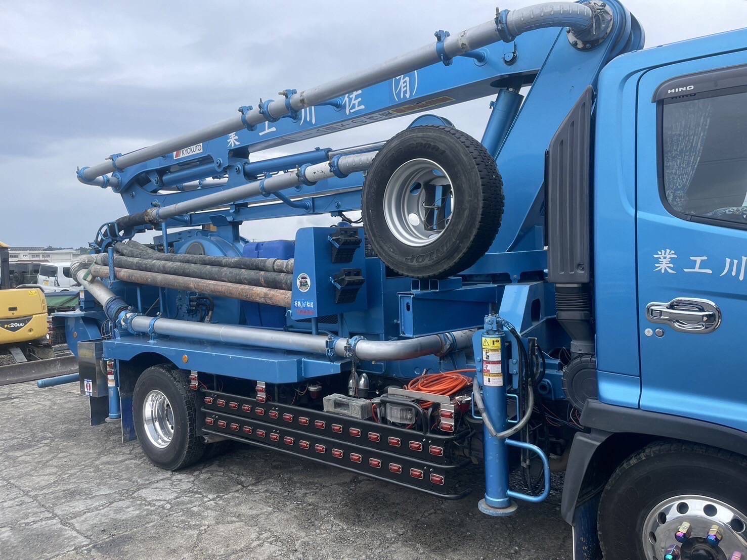 Close up of blue industrial crane truck
